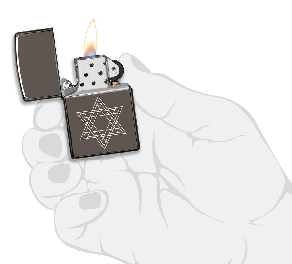 Star of David Design Black Ice?« Windproof Lighter lit in hand.
